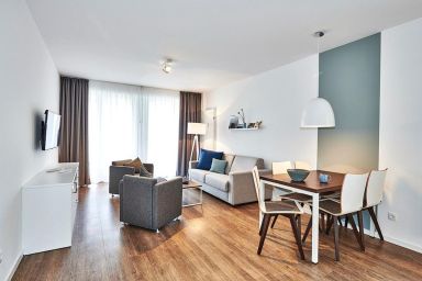 Deichhäuser Anna Küste - Strandnahes, schickes Apartment mit Terrasse inkl. Schwimmbad- & Saunanutzung