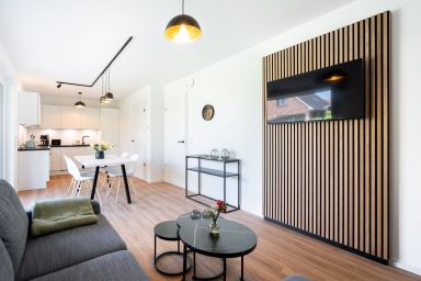 Küstenhain Lodge - Ihr Rückzugsort am Meer – stilvolle Erdgeschosswohnung mit Terrasse