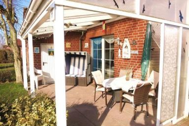 Ferienhaus Huus Wattenmeer in Nessmersiel mit Garten, Terrasse, Sauna, Räder, und Grill