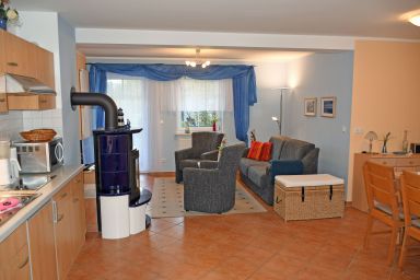 Ferienwohnungen mit Kamin und Blick zum Selliner Seepark - Ferienwohnung mit Balkon und Kamin Hühnergott