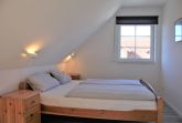 Schlafzimmer mit Doppelbett