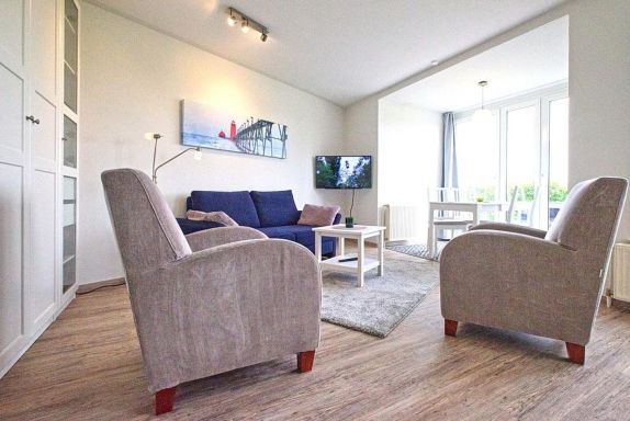 Wohnbereich mit Couch und Sesseln