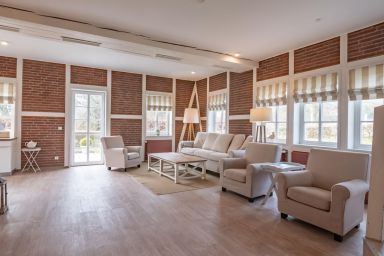 Apparthotel Seehof Lütt Hus - Großes freistehendes Ferienhaus für sechs Personen mit Terrasse und Seeblick