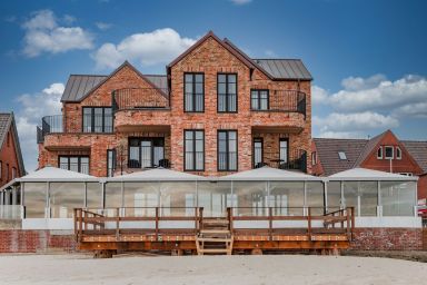 Hüs Hallig Luk Wohnung 1 - Moderne Ferienwohnung mit außergewöhnlichem Meerblick direkt am Strand von Wyk