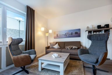 Aparthotel Ostseeallee - Geschmackvolles Ferienapartment für 4 Personen mit sonnigem Balkon in Strandnähe