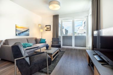 Aparthotel Ostseeallee - Hochwertiges Familienapartment mit Balkon und Strandkorb - Saunabereich im Haus!