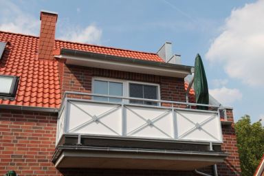 Pusteblume - Moderne 75qm Ferienwohnung für 4 Personen mit Kamin & Balkon in zentraler Lage