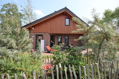 Feriendorf Südstrand - Großzügiges 8-Personen-Ferienhaus mit Sauna, Kamin und Garten in Strandnähe