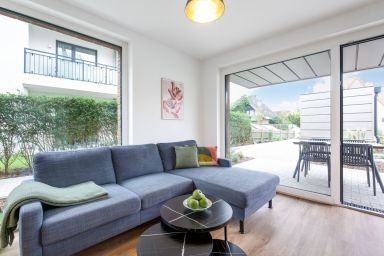 Küstenhain Lodge - Gemütliche 63m²  Erdgeschosswohnung mit Terrasse für vier Personen