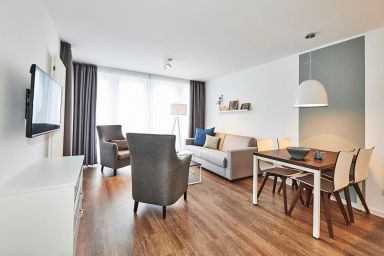 Deichhäuser Anna Küste - Strandnahes Familienapartment mit Balkon inklusive Schwimmbad- & Saunanutzung