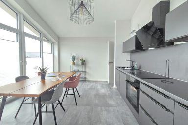 Ferienwohnung Penthouse Wasserperle - Modernes Penthouse mit überdachtem Balkon und Flussblick im Herzen von Norden