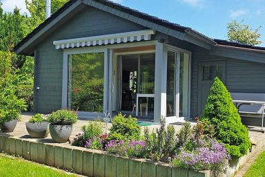 Blockhaus mit Wintergarten und Kamin - Blockhaus in Damp