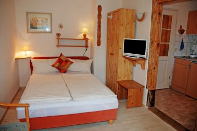 Appartementhaus zur Brücke direkt am See - Ferienappartement Pusteblume mit Terrasse